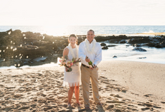 Nicole & Tim tie the knot at Paradise Cove Beach in Oahu, Hawaii